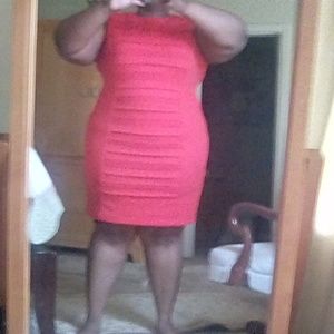 Red sleeveless midi dress.